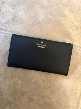 kate spade black continental zip-around wallet with gold logo